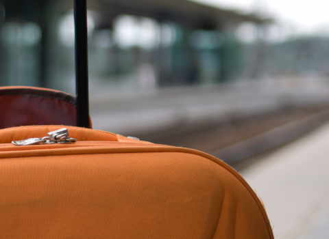 Suitcase waiting at a train station